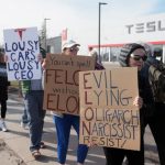Protesters Rally Against Elon Musk Outside Tesla Dealership in Ann Arbor