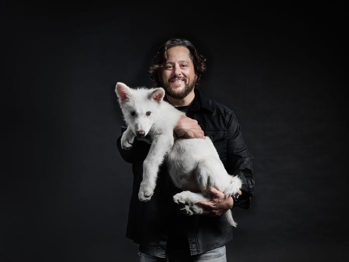 Gentle Guardian: A Man and His Wolf Pup